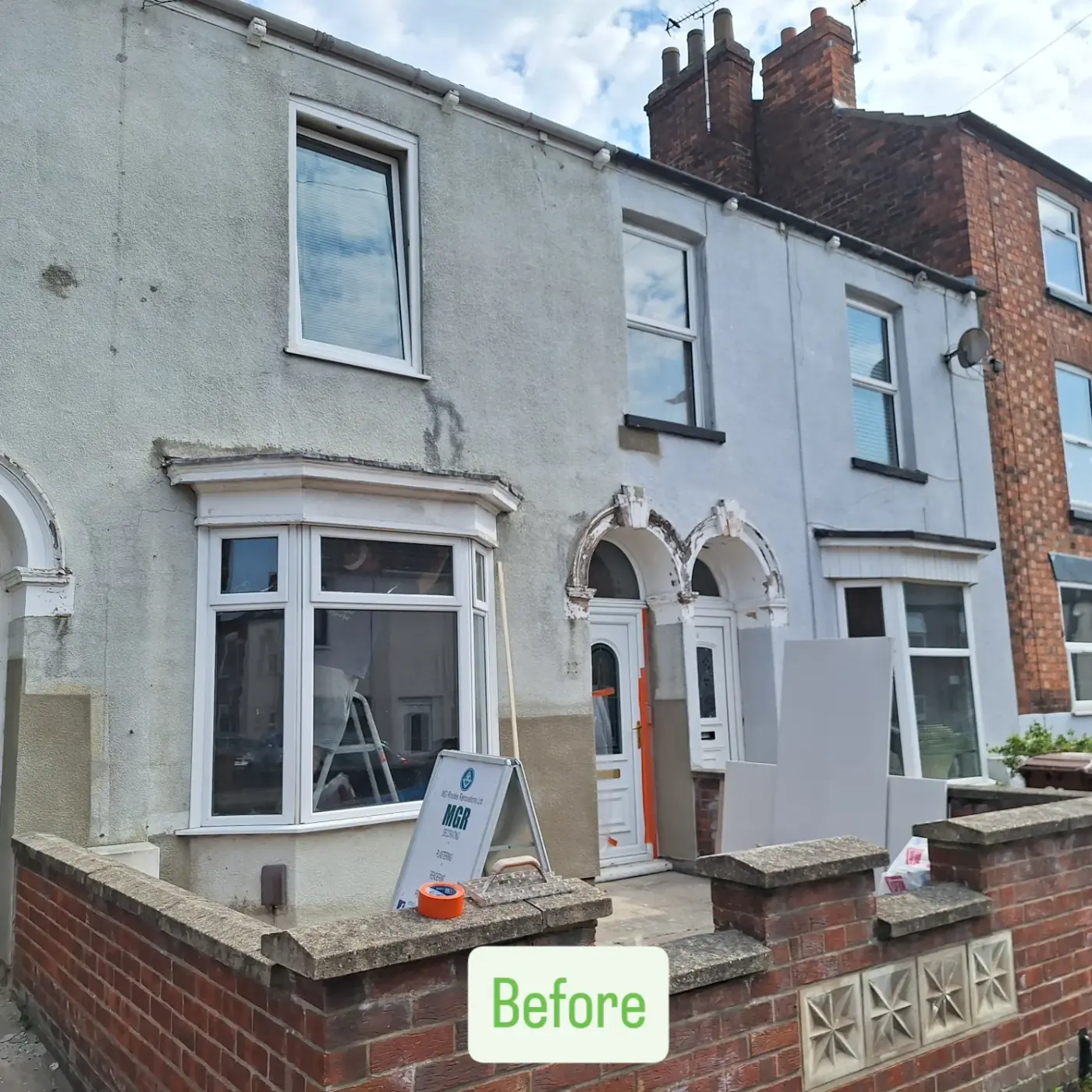 Victorian terrace before: stained render and damaged bay and door arches